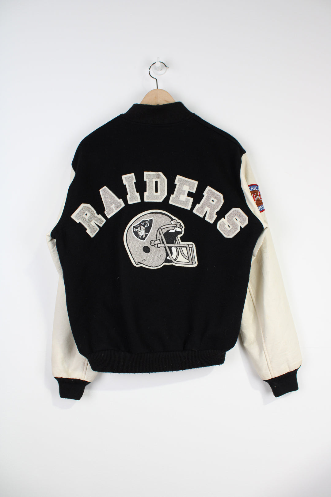 Vintage NFL Oakland Raiders Pro-Sport bomber jacket with embroidered team graphic on the front and back