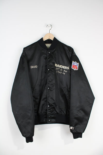 Vintage 90's NFL Raiders 30th yr. fan, black satin bomber jacket by Pro Line,  with embroidered team graphic on the front and back and autographed lining 