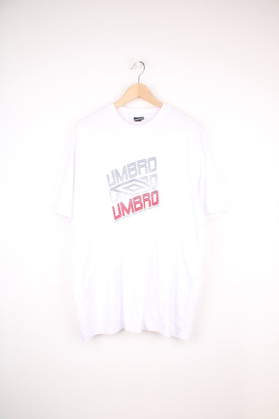 Umbro T-Shirt in a white colourway, short sleeve crewneck, and has logo spell out printed on the front.
