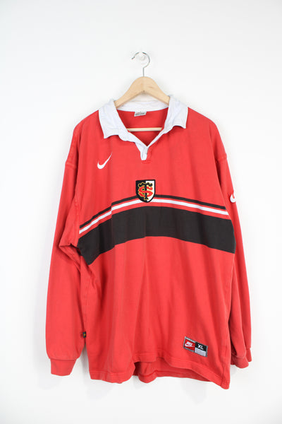Vintage 1990s Stade Toulousain rugby shirt by Nike, features embroidered badges on the chest and sleeve