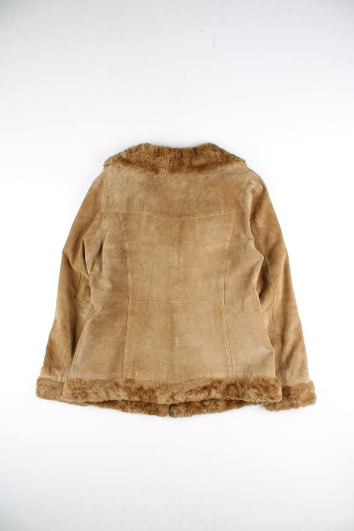 Vintage Y2K Xhilaration Leather Afghan Coat in a brown colourway. Clasp closure, has side pockets, insulated, and has a faux fur trim and collar.