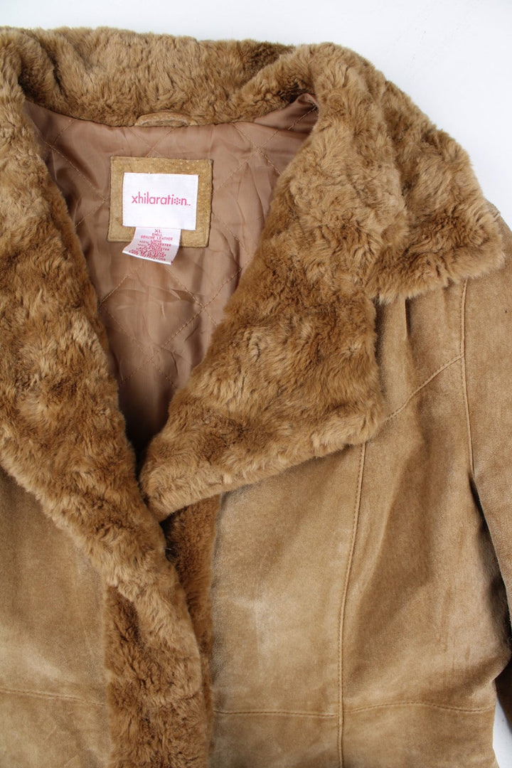 Vintage Y2K Xhilaration Leather Afghan Coat in a brown colourway. Clasp closure, has side pockets, insulated, and has a faux fur trim and collar.