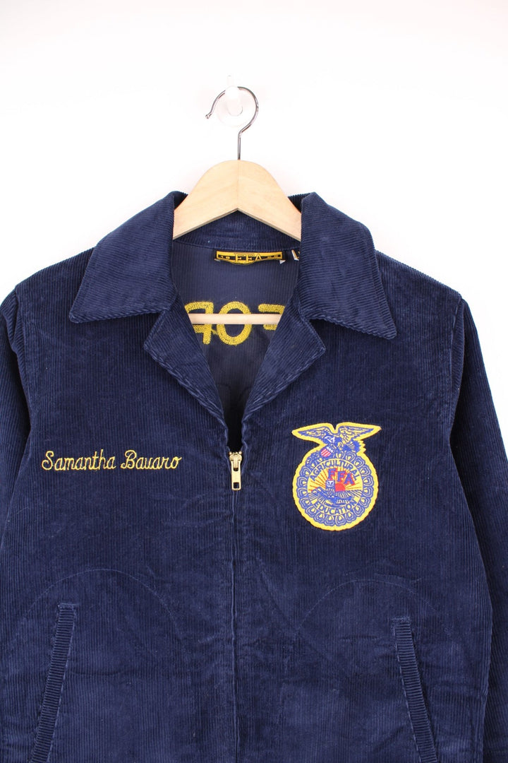 1980s FFA Agricultural Education, Escalon, California navy blue corduroy jacket with FFA crest on front and back, and the name 'Samantha Bavaro' embroidered. With zip closure and two slit side pockets. 