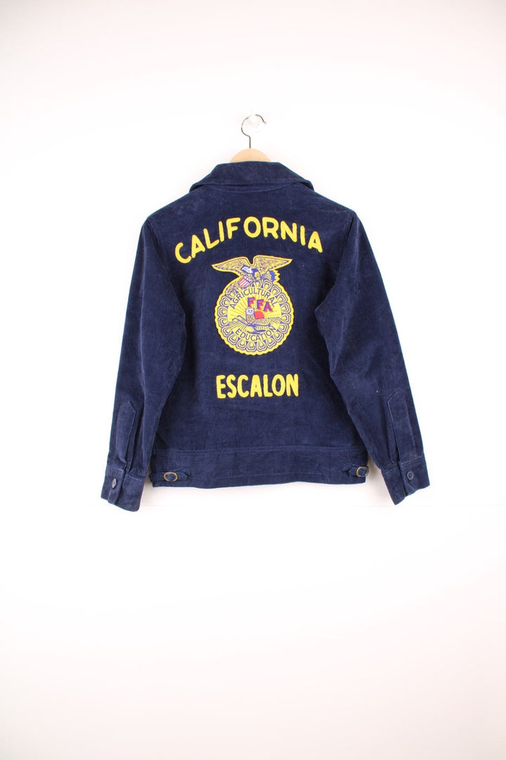 1980s FFA Agricultural Education, Escalon, California navy blue corduroy jacket with FFA crest on front and back, and the name 'Samantha Bavaro' embroidered. With zip closure and two slit side pockets. 