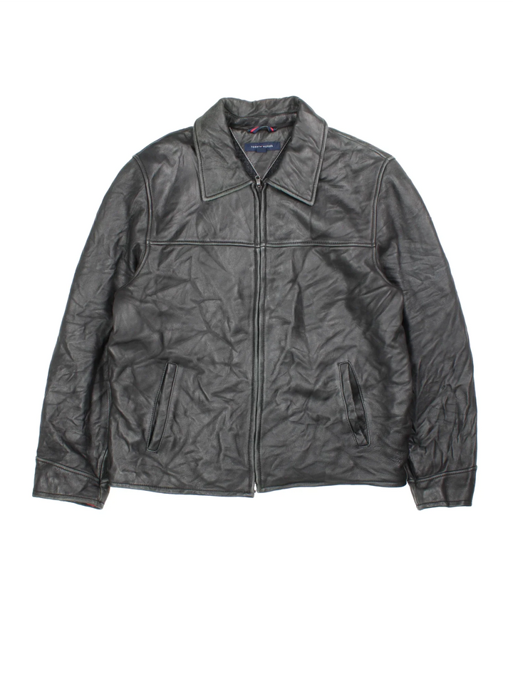 Vintage Tommy Hilfiger Leather Jacket in a black colourway. Zips up and has side pockets and a wool blend lining.