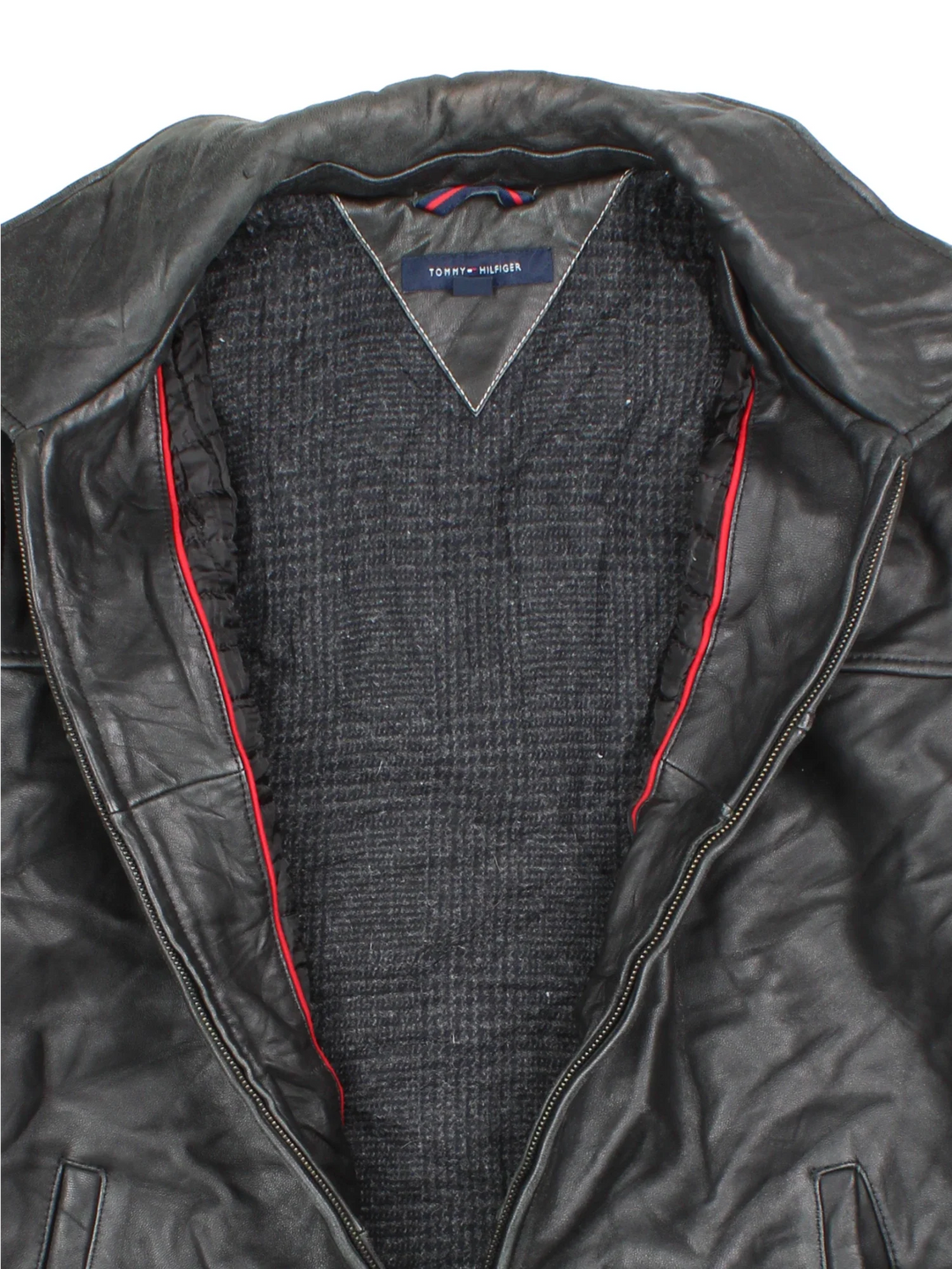 Vintage Tommy Hilfiger Leather Jacket in a black colourway. Zips up and has side pockets and a wool blend lining.