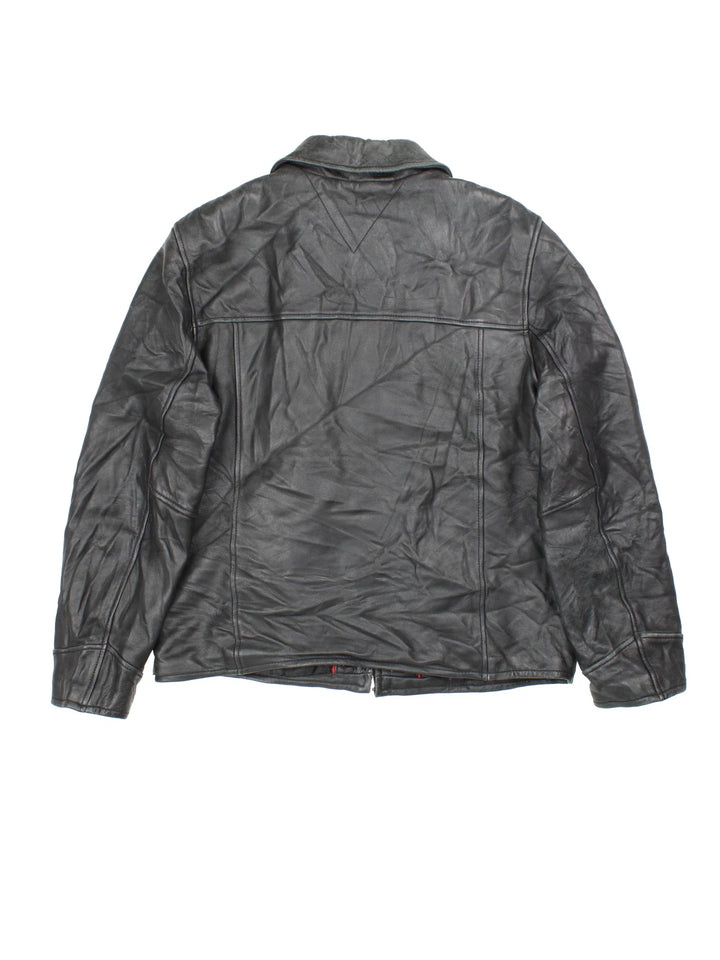 Vintage Tommy Hilfiger Leather Jacket in a black colourway. Zips up and has side pockets and a wool blend lining.