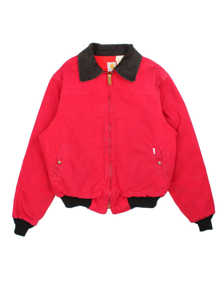 Vintage Carhartt Santa Fe Jacket in a red colourway. Zips up and has side pockets, insulated lining, and has the logo tab embroidered on the front.