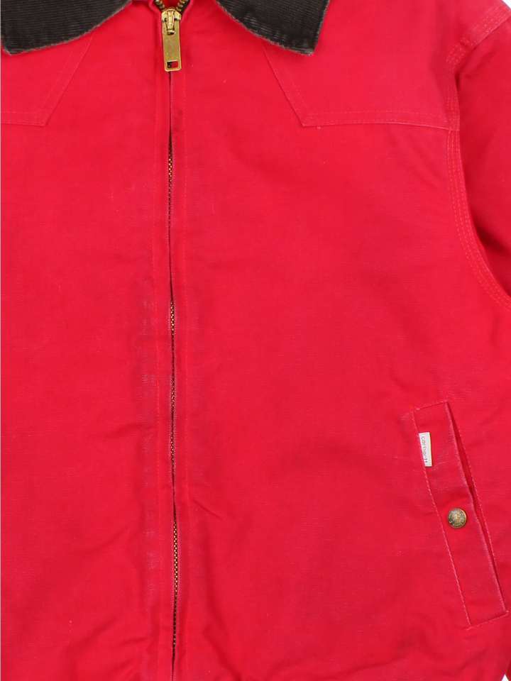 Vintage Carhartt Santa Fe Jacket in a red colourway. Zips up and has side pockets, insulated lining, and has the logo tab embroidered on the front.