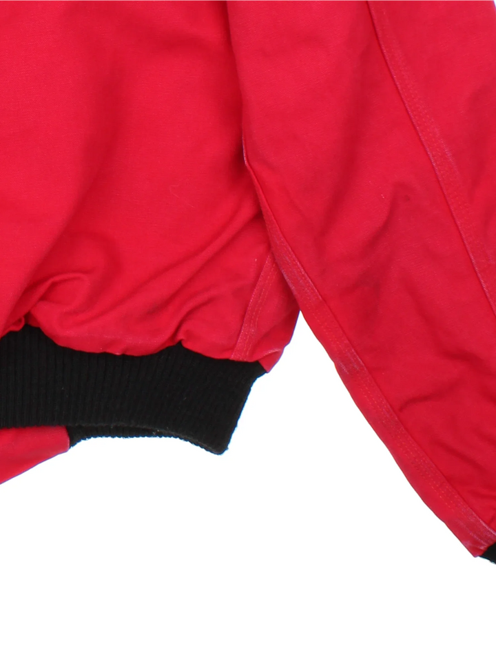 Vintage Carhartt Santa Fe Jacket in a red colourway. Zips up and has side pockets, insulated lining, and has the logo tab embroidered on the front.