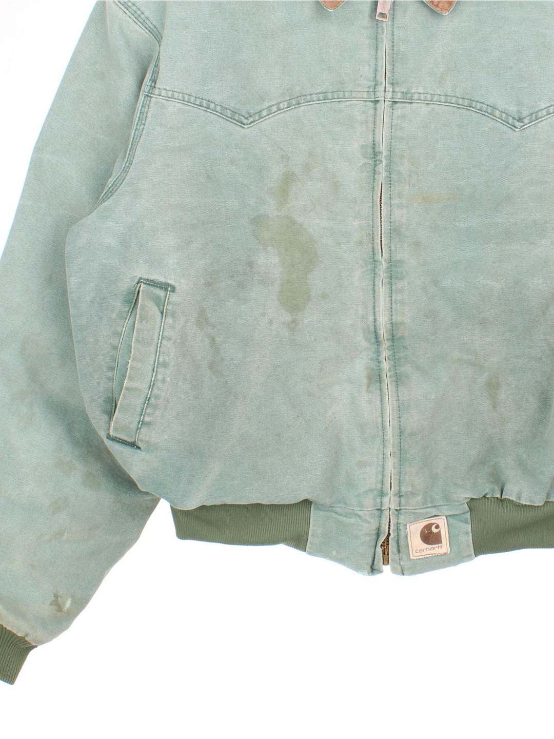 Vintage Carhartt Santa Fe Jacket in a green colourway. Zips up and has side pockets, insulated lining, and has the logo embroidered on the front by the hem.