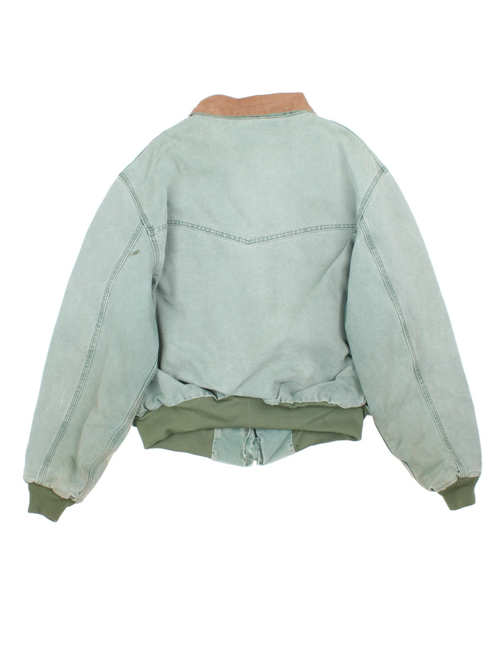 Vintage Carhartt Santa Fe Jacket in a green colourway. Zips up and has side pockets, insulated lining, and has the logo embroidered on the front by the hem.