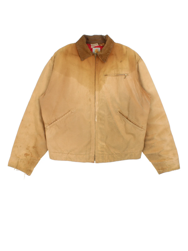 Vintage 80's Carhartt Detroit Jacket in a tan colourway. Zips up and has multiple pockets, insulated with a quilted lining, and has a corduroy collar.
