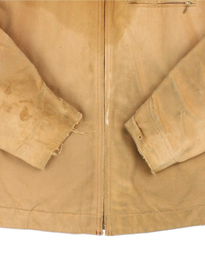 Vintage 80's Carhartt Detroit Jacket in a tan colourway. Zips up and has multiple pockets, insulated with a quilted lining, and has a corduroy collar.
