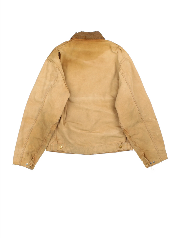 Vintage 80's Carhartt Detroit Jacket in a tan colourway. Zips up and has multiple pockets, insulated with a quilted lining, and has a corduroy collar.