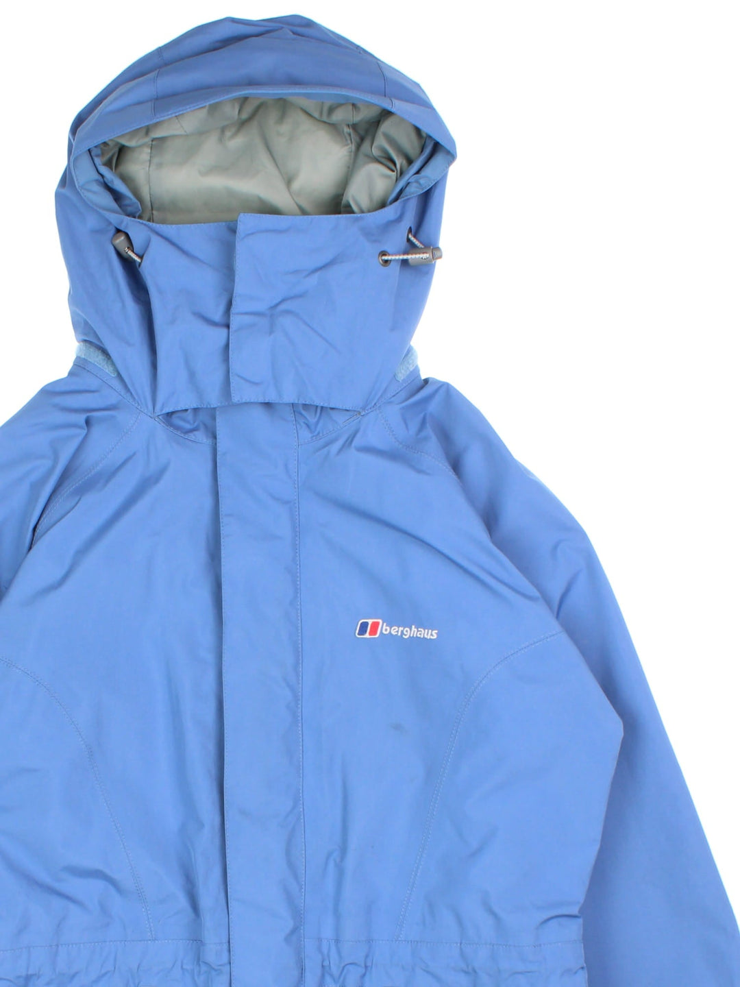 Berghaus Gore-Tex Jacket in a blue colourway. Zips up and has side pockets, mesh lining, hooded, and has the logo embroidered on the front.
