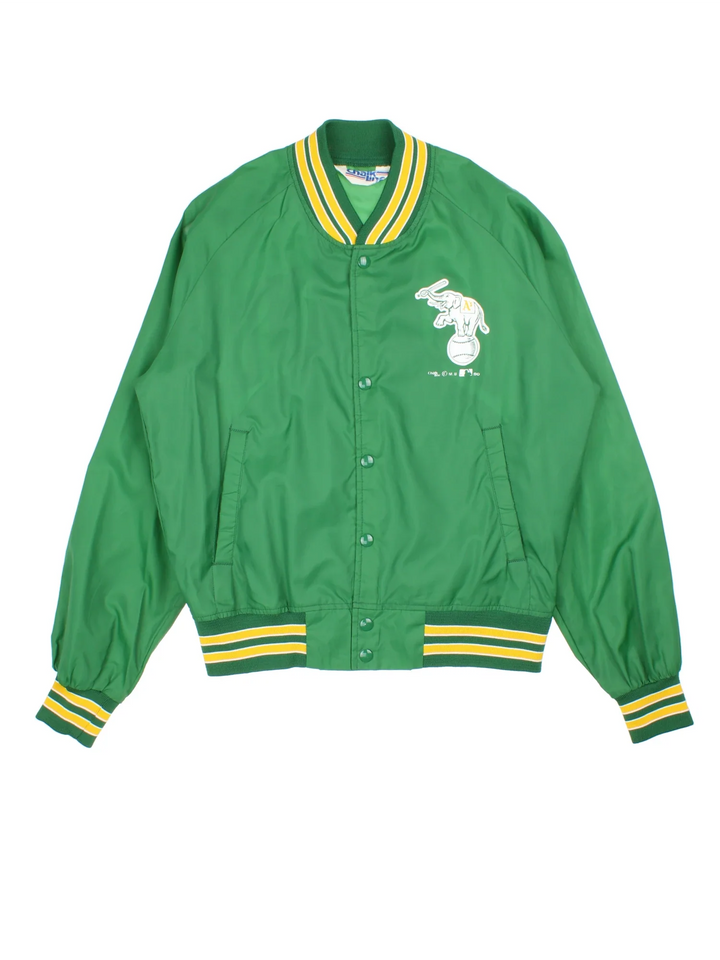Vintage 1989 Oakland Athletics Chalk Line MLB Varsity Jacket in a green colourway. Zips up and has side pockets, and the team logo / spell out printed on the front and back.