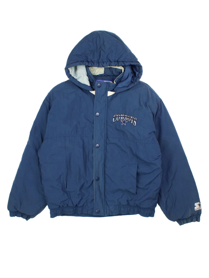 Vintage Dallas Cowboys NFL Starter Jacket in a blue colourway. Zips and buttons up, has side pockets, insulated lining, hooded, and has the team logo embroidered on the front and back.