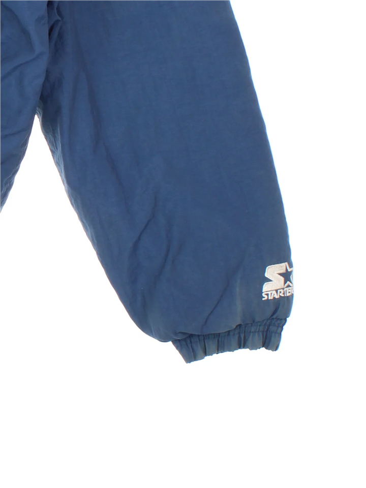 Vintage Dallas Cowboys NFL Starter Jacket in a blue colourway. Zips and buttons up, has side pockets, insulated lining, hooded, and has the team logo embroidered on the front and back.