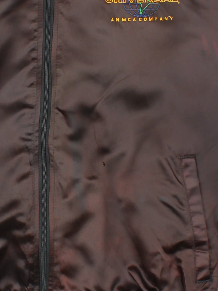 Vintage Universal Studios Varsity Jacket in a brown colourway. Zips up and has side pockets, and the logo embroidered on the front and back.