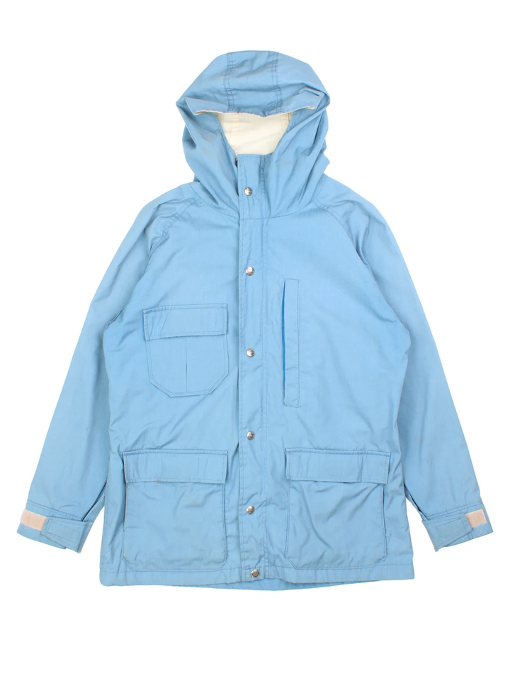 Vintage Woolrich Parka Jacket in a blue colourway. Zips up, hooded and has multiple pockets.