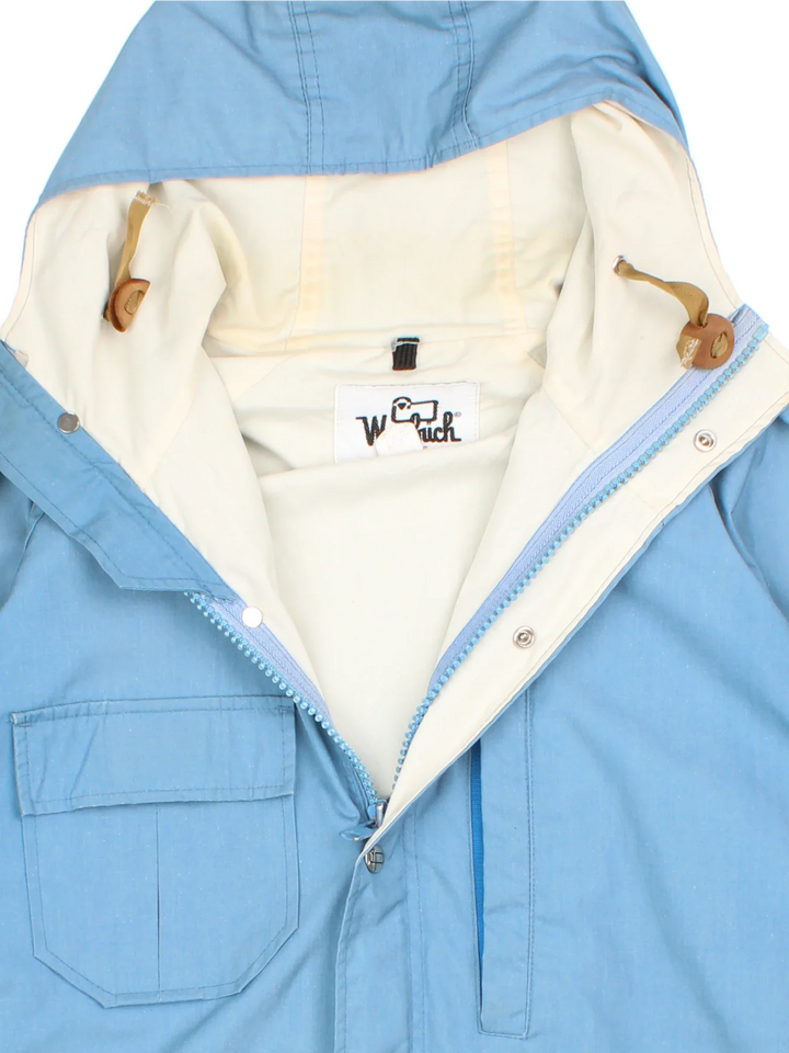 Vintage Woolrich Parka Jacket in a blue colourway. Zips up, hooded and has multiple pockets.