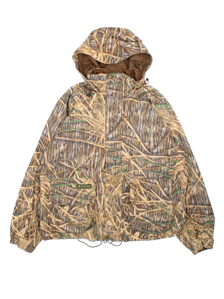 Vintage Columbia Real Tree Camo Jacket in a brown and green colourway. Zips up and has multiple pockets, hooded, and has the logo embroidered on the front.