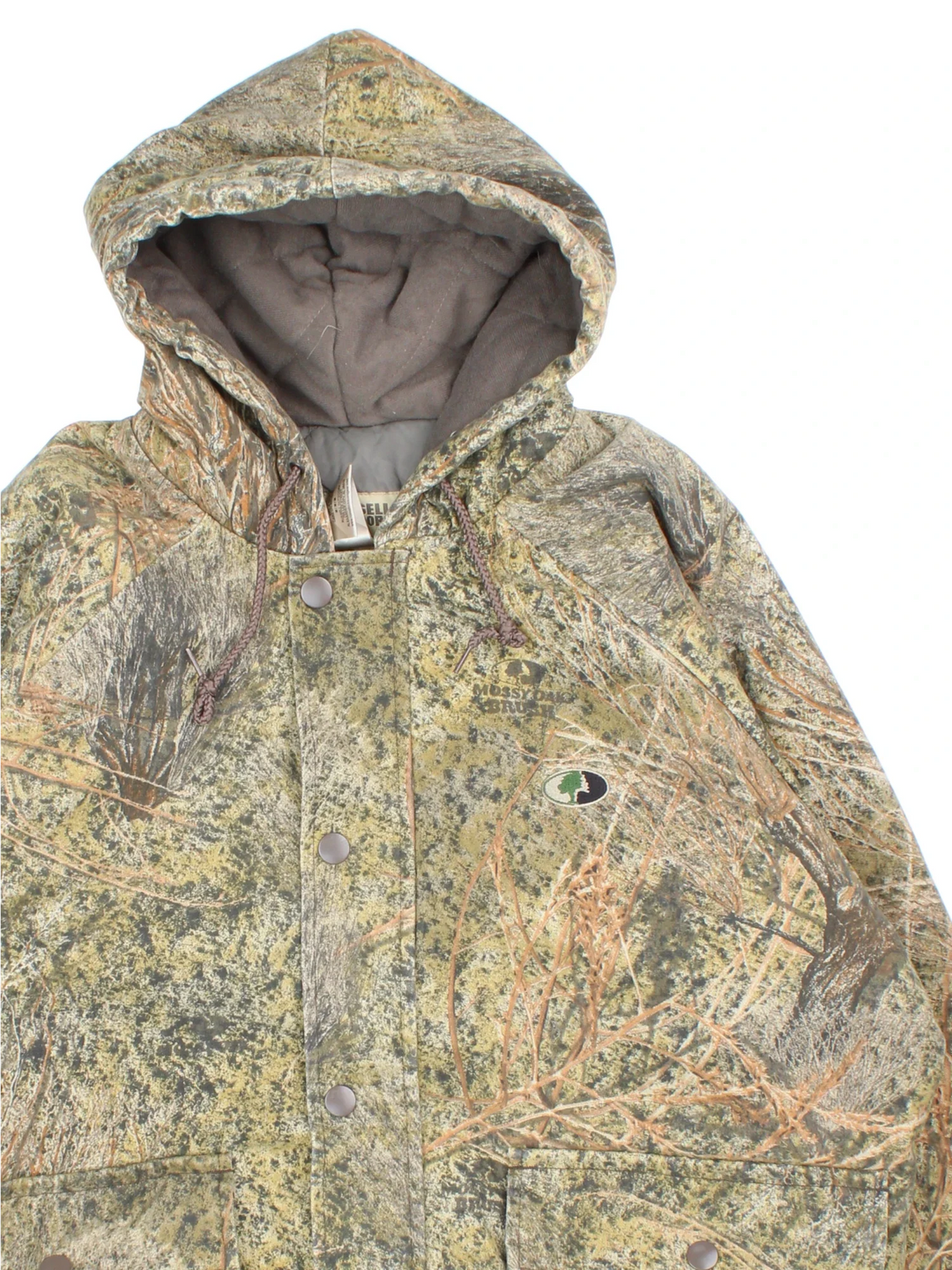 Vintage Russell Athletic Outdoors Mossy Oak Hooded Jacket in a green and green colourway. Zips up and has multiple pockets, insulated with a quilted lining, and has the logo embroidered on the front.