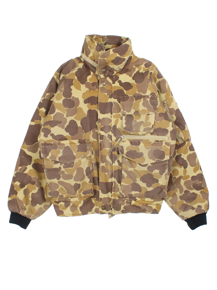 Vintage Gamehide Camo Hunting Jacket in a brown and green colourway. Zips up and has multiple utility pockets, insulated with a quilted lining and has a hidden hood.