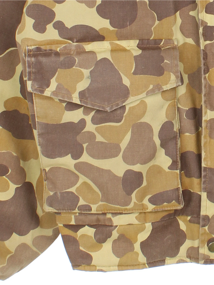 Vintage Gamehide Camo Hunting Jacket in a brown and green colourway. Zips up and has multiple utility pockets, insulated with a quilted lining and has a hidden hood.