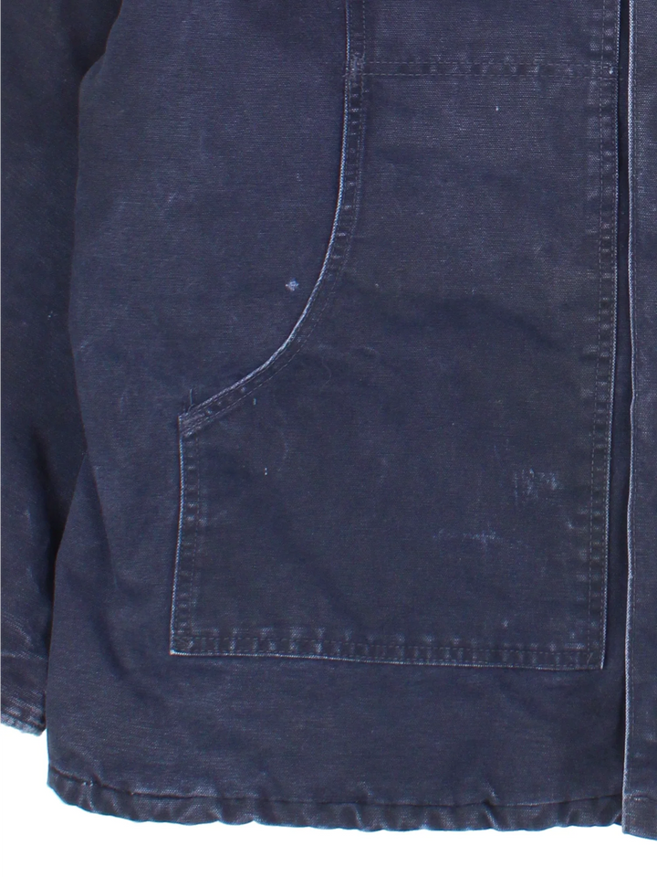 Vintage Carhartt Arctic Jacket in a navy blue colourway with a brown corduroy collar. Zips up and has multiple pockets, insulated with a quilted lining, and has the logo embroidered on the front.