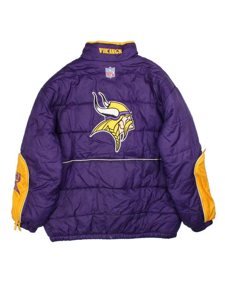 Vintage Minnesota Vikings Reebok NFL Puffer Jacket in a purple and yellow colourway. Zips up and has multiple pockets, insulated lining, and has the logos embroidered on the front.