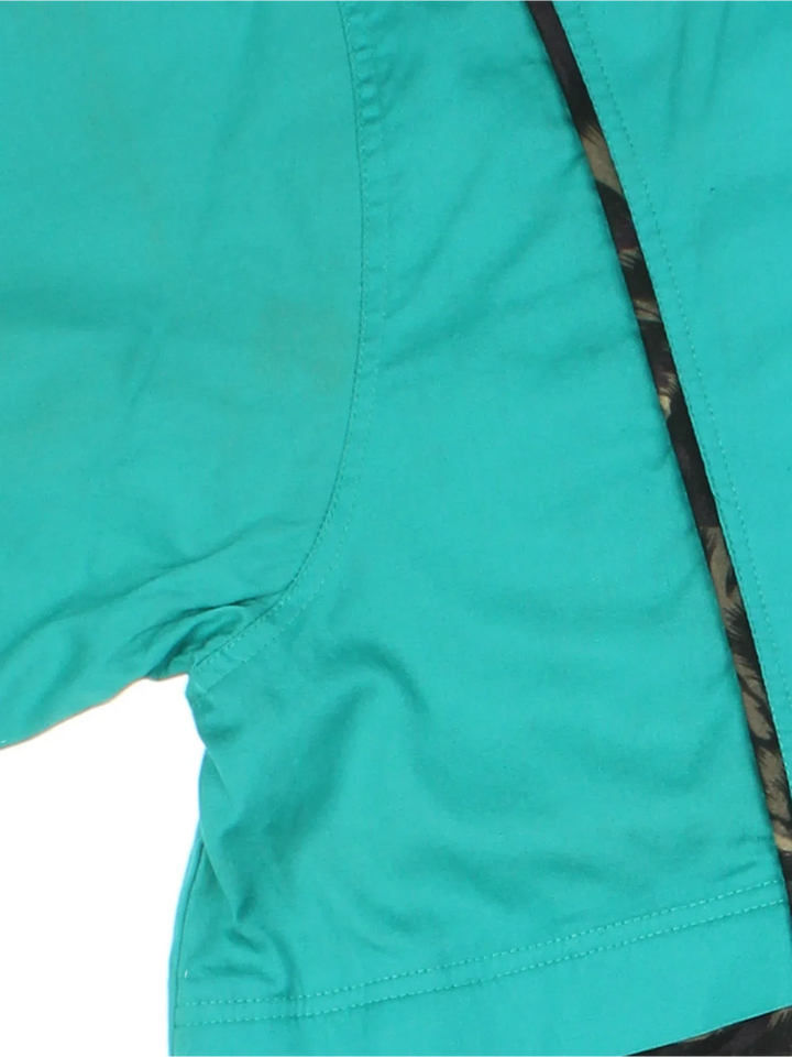 Vintage 90's Fila Jacket in a green/black colourway. Zips up and has front pockets, elasticated collar/cuffs, animal print contrast piping and logo embroidered on the front.
