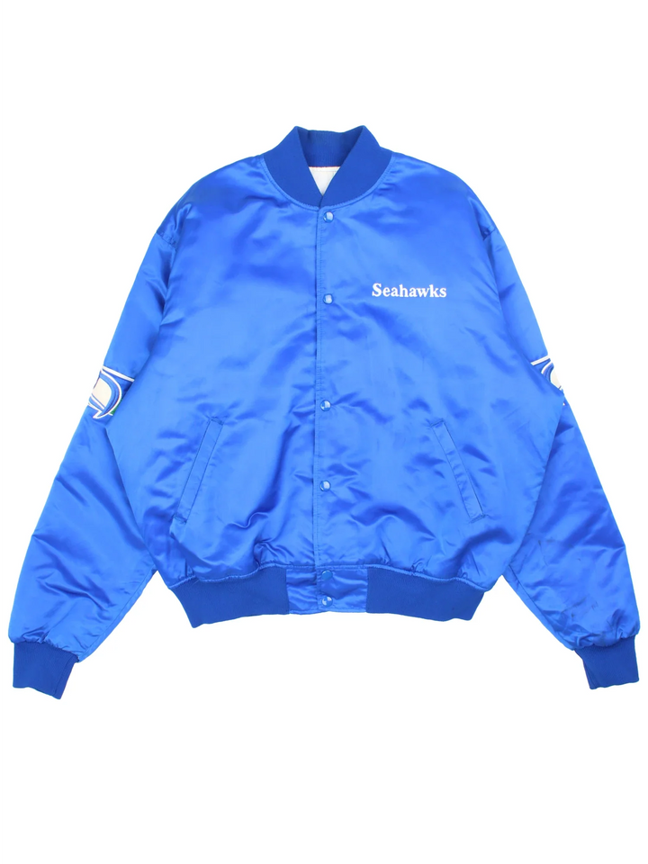 90's Seattle Seahawks NFL Starter Varsity Jacket in a blue colourway. Buttons up and has side pockets, insultaed with a quilted lining, has the team detailing on the sleeves and small logo on the front.