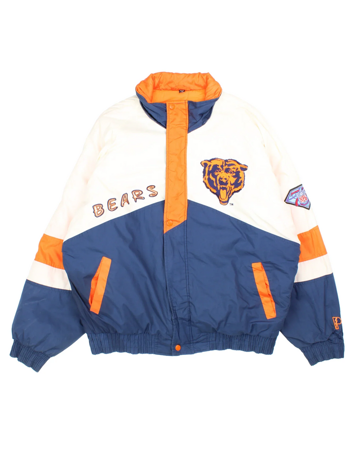 90's Chicago Bears Pro Player Jacket in a white and blue colourway with orange detailing. Full zip up and two pockets on the front with large team logo on the front and sleeves with larger logo and graphic across the back.