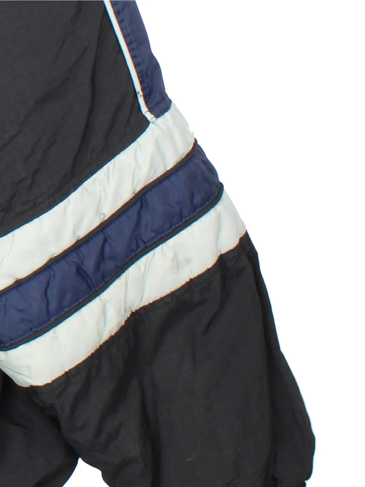 Dallas Cowboys NFL Starter Jacket in a black and blue colourway with grey detailing. Full zip with multiple pockets. Classic logo on the chest and large star logo on the back.