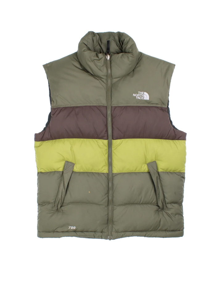The North Face 700 Gilet in a green colourway with tonal stripe panelling, two pockets, full zip and small classic logo on the front.