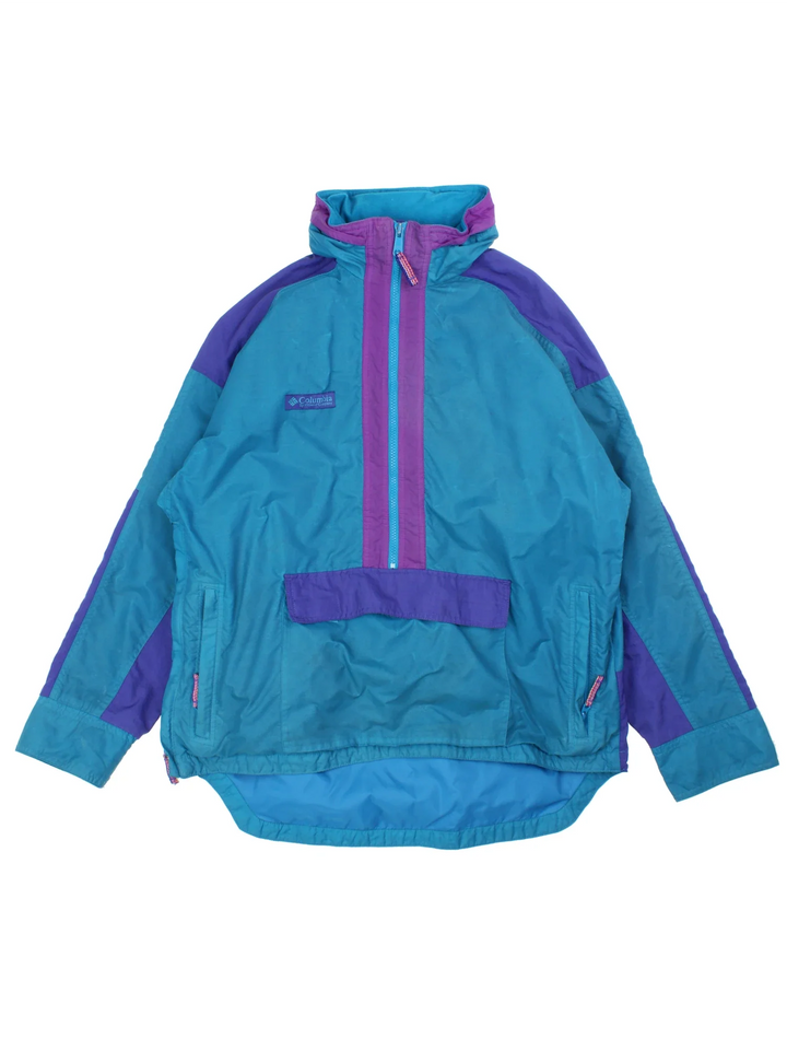 Vintage 90's Columbia Jacket in a blue colourway with retro tonal panelling. Half zip with large pocket on the front and two zip side pockets. Small logo on the chest.