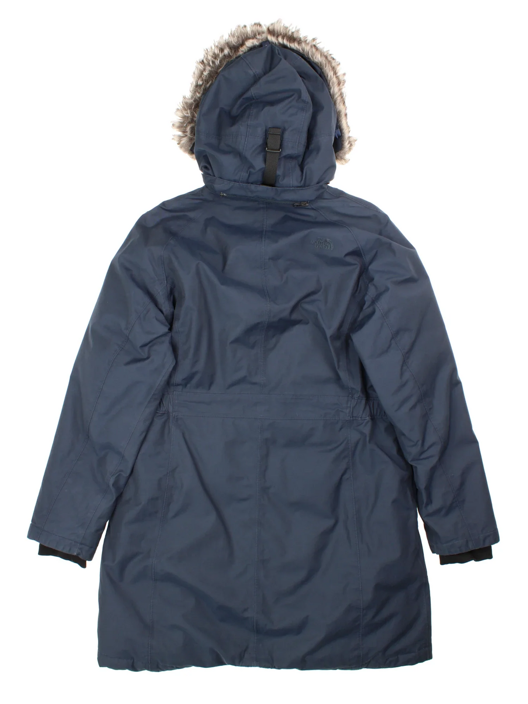 The North Face Parka Coat in a blue colourway with faux fur hood. Full zip with buttons nd two pockets on the side. Small classic logo on the back.