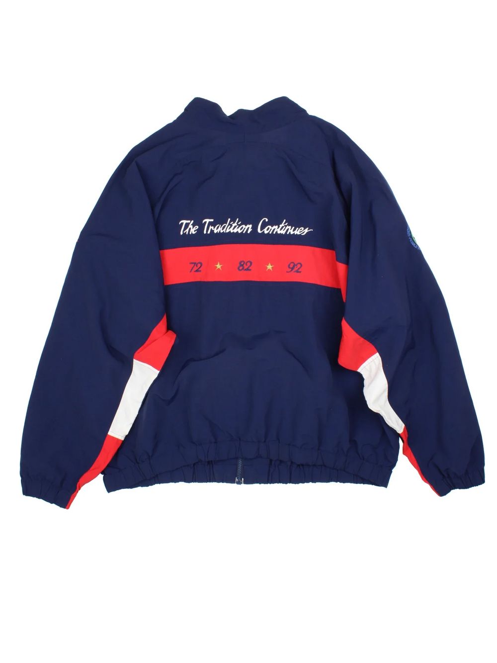 Vintage 1992 US Open Pebble Beach Jacket in a blue colourway with red and white panelling. Full zip with two pockets and small logos on the front and sleeve. Logo and detailing running across the back. 