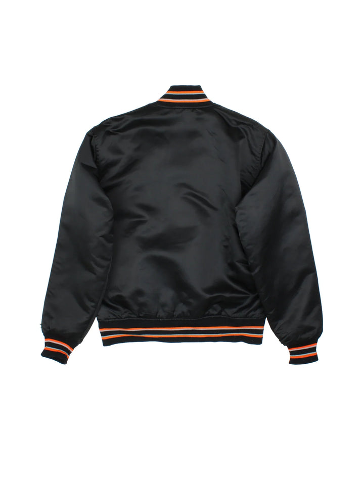 Vintage Starter San Francisco Giants Bomber Jacket in a black colourway with orange and grey detailing. Buttons up and has side pockets, quilted lining, and has the logos embroidered on the front.