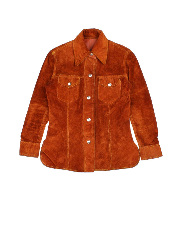 Vintage 80's Reversible Leather Jacket in a orange colourway in either a leather or suede reversible options. Buttons up and has double chest pockets, and features contrast stitching details.
