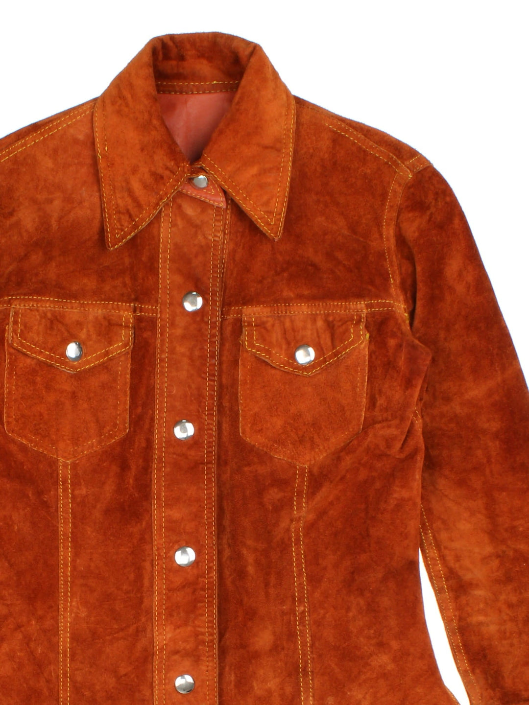 Vintage 80's Reversible Leather Jacket in a orange colourway in either a leather or suede reversible options. Buttons up and has double chest pockets, and features contrast stitching details.