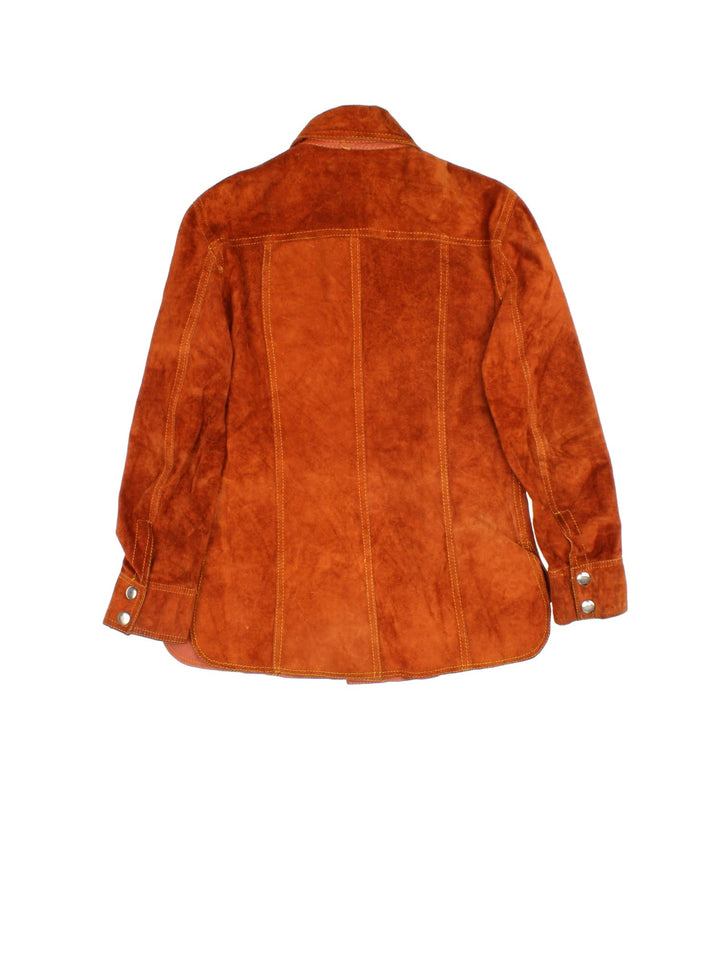 Vintage 80's Reversible Leather Jacket in a orange colourway in either a leather or suede reversible options. Buttons up and has double chest pockets, and features contrast stitching details.