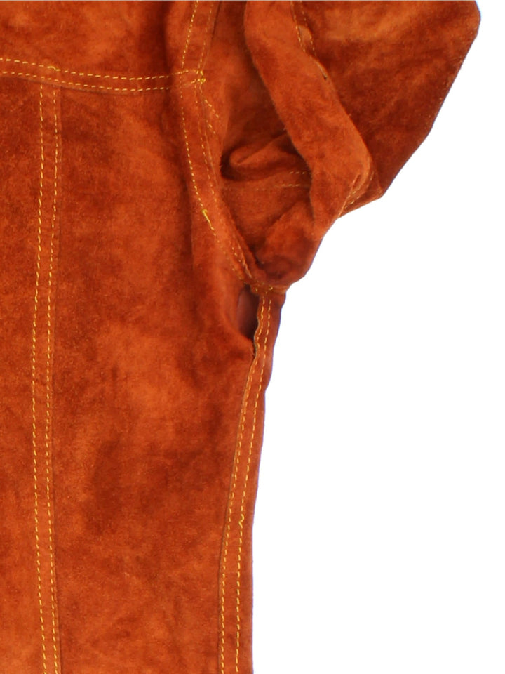 Vintage 80's Reversible Leather Jacket in a orange colourway in either a leather or suede reversible options. Buttons up and has double chest pockets, and features contrast stitching details.