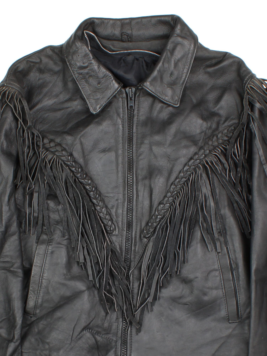 Vintage Western Leather Fringe Jacket in a black colourway. Zips up and has side pockets, and features fringe tassel detailing on the front, back and down the sleeves.