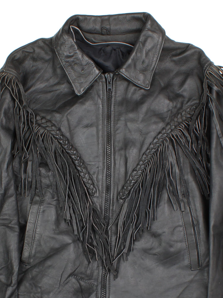 Vintage Western Leather Fringe Jacket in a black colourway. Zips up and has side pockets, and features fringe tassel detailing on the front, back and down the sleeves.