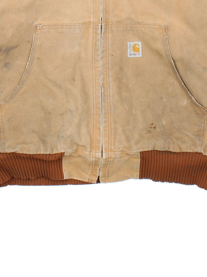 Vintage Carhartt Active Jacket in a tan colourway. Zips up and has side pockets, hooded, and has the logo embroidered on the front.