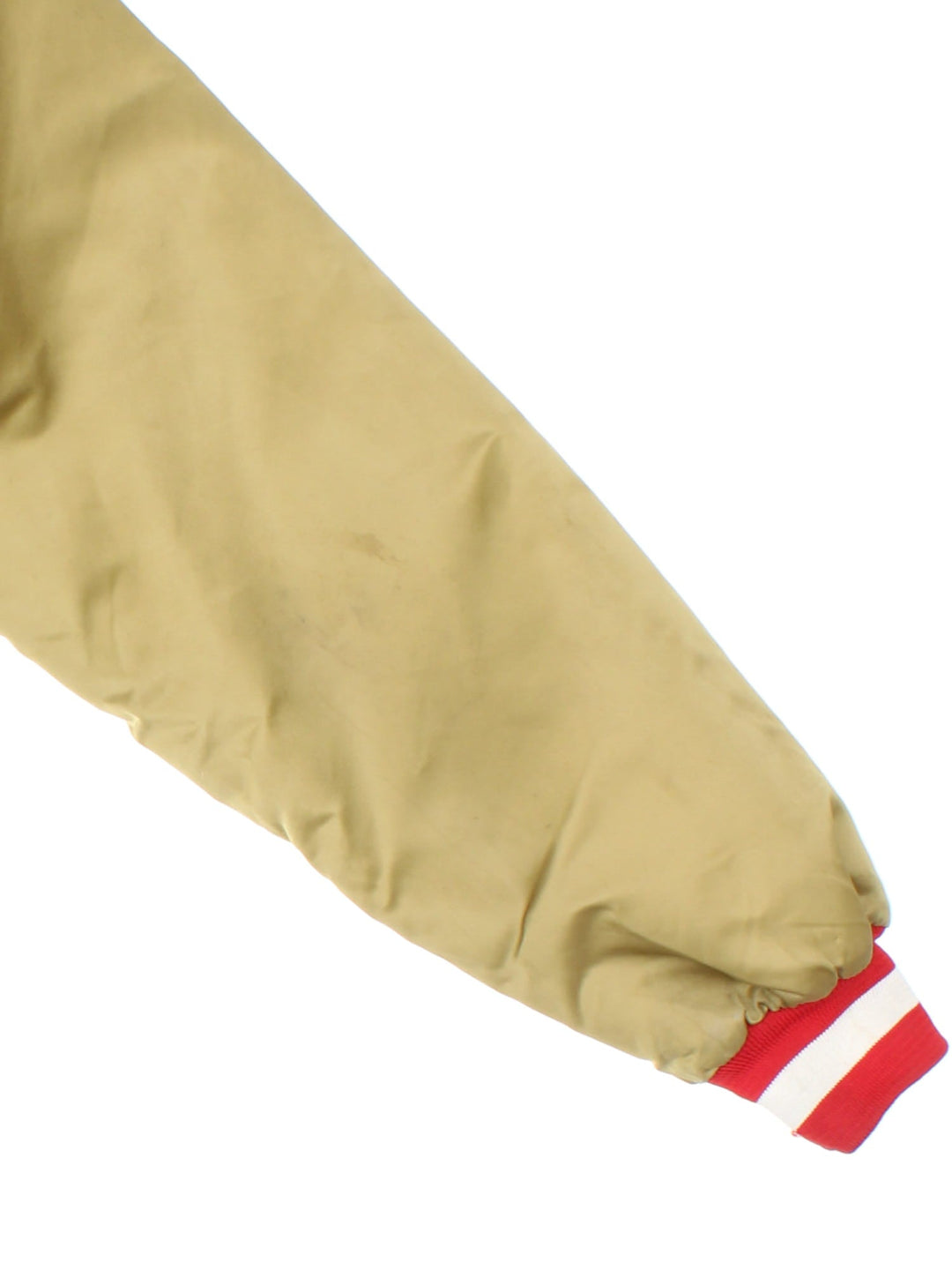 Vintage San Francisco 49ers NFL Chalk Line Varsity Jacket in a gold tan colourway. Buttons up and has side pockets, insulated with a quilted lining, and has the team logo and spell out embroidered on the front and back.