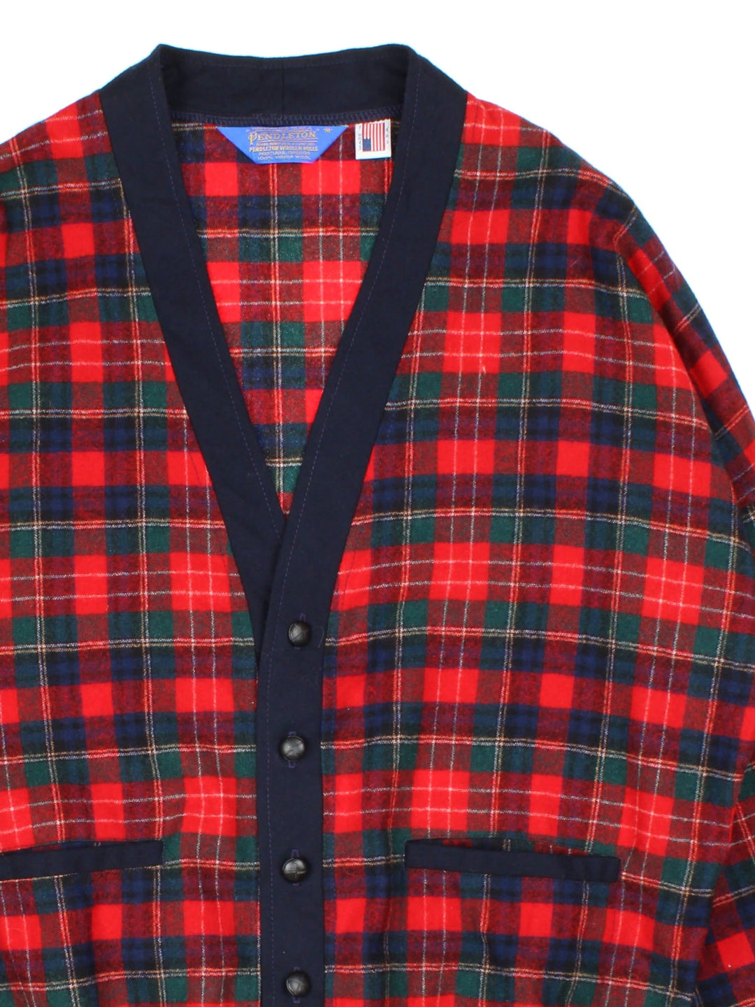 Vintage Pendleton Plaid Wool Cardigan in a red patterned colourway. Buttons up and has double front pockets, and a big collar.